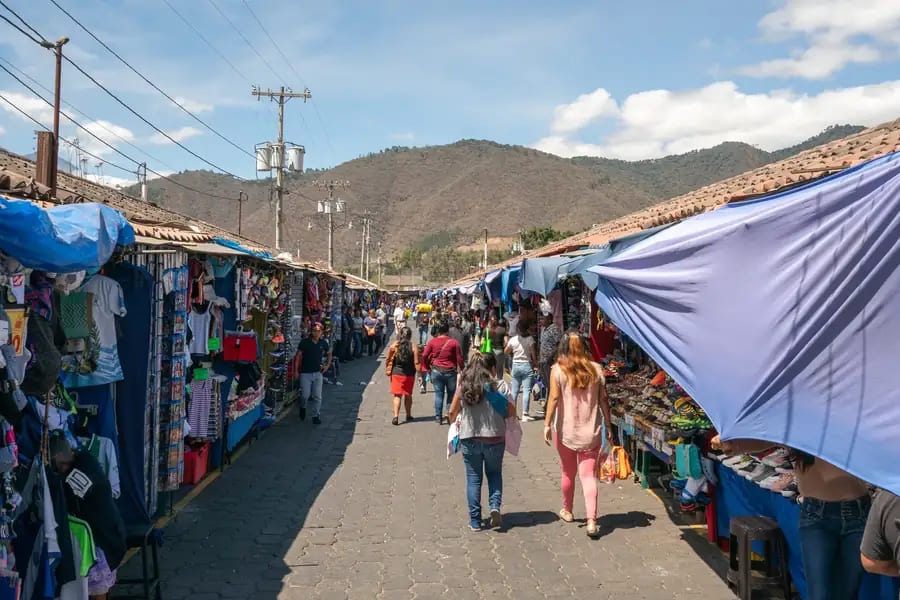 Vendors selling fruits and vegetables at the Mercado Central of Antigua Guatemala