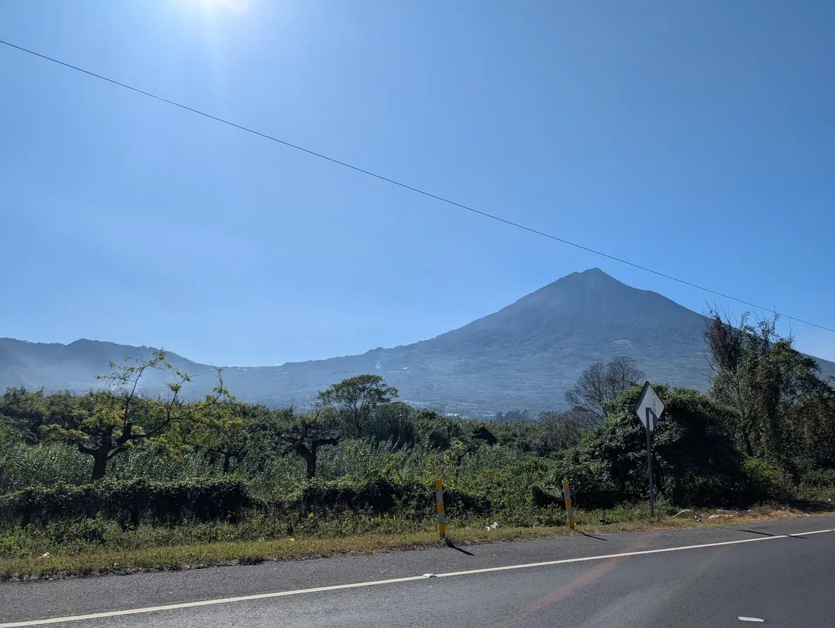 RN-14 highway approaching Antigua Guatemala with Volcan de Agua in the distance