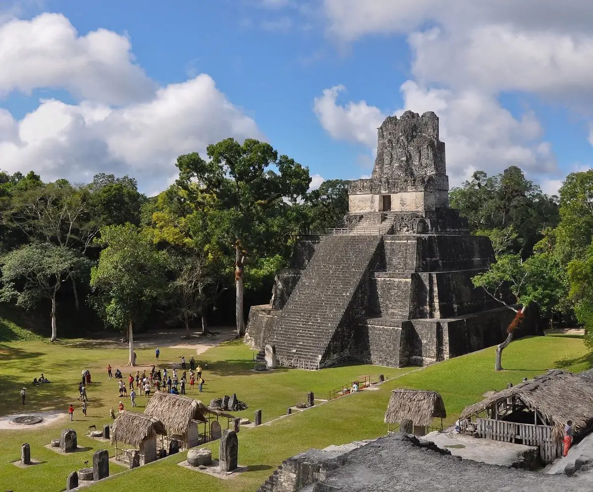 Mayan temple rising from the jungle canopy at Tikal National Park, Peten, Guatemala