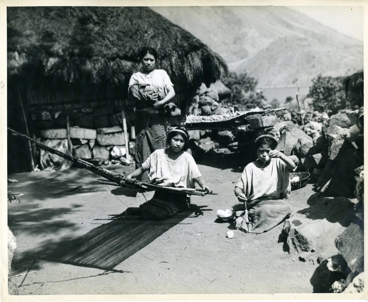 Maya women spinning wool by hand in the Lake Atitlan region of Guatemala