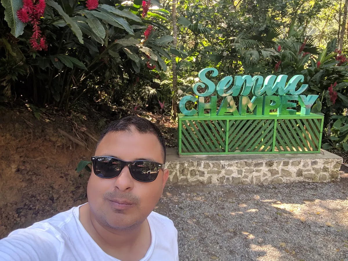 Estuardo Enriquez at the Semuc Champey entrance sign, Alta Verapaz
